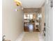 Bright entryway with tile flooring, light fixtures, and views to the open living area at 1581 Gulf Blvd # 301N, Clearwater Beach, FL 33767