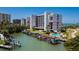 Waterfront condo building with boat docks and a pool, set against a beautiful coastal backdrop at 1581 Gulf Blvd # 301N, Clearwater Beach, FL 33767