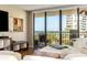 Living room with ocean view and balcony access, featuring comfortable seating and a modern entertainment setup at 1581 Gulf Blvd # 301N, Clearwater Beach, FL 33767