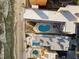 Stunning aerial view of beachfront property with pools and beautiful sandy shoreline at 16400 Gulf Blvd # 505, North Redington Beach, FL 33708