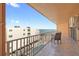 A view from the tiled balcony highlighting a table, chairs, and ocean view at 16400 Gulf Blvd # 505, North Redington Beach, FL 33708