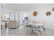 Cozy living area with dining table, a sofa, and bright natural light at 16400 Gulf Blvd # 505, North Redington Beach, FL 33708
