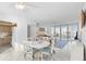 Bright open space with dining area, a sofa, and access to a balcony at 16400 Gulf Blvd # 505, North Redington Beach, FL 33708