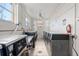 Well-lit laundry room with multiple washers and dryers, white walls, and tile floors at 16400 Gulf Blvd # 505, North Redington Beach, FL 33708