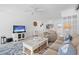 Cozy living area with seating, media center, and dining area with ample light at 16400 Gulf Blvd # 505, North Redington Beach, FL 33708
