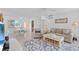 Bright living room with beachy accents, comfortable seating, and dining area at 16400 Gulf Blvd # 505, North Redington Beach, FL 33708
