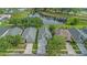 An aerial shot showcases this lovely home with a pond view, highlighting its location in a desirable neighborhood at 18836 Maisons Dr, Lutz, FL 33558