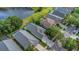 An aerial view features a private backyard oasis with a screened-in pool, ideal for relaxation and entertaining at 18836 Maisons Dr, Lutz, FL 33558