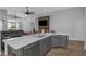 Elegant kitchen with a large island, stainless steel appliances, and an open floor plan at 18836 Maisons Dr, Lutz, FL 33558