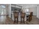 Stylish kitchen boasts gray cabinets, a large island with bar seating, and wood-look tile flooring at 18836 Maisons Dr, Lutz, FL 33558
