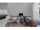 Spacious home office with multiple desks and good lighting, perfect for working from home at 18836 Maisons Dr, Lutz, FL 33558