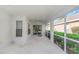A covered patio with access to a screened patio and backyard at 18836 Maisons Dr, Lutz, FL 33558