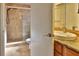 Bathroom featuring a modern vanity, granite countertops, and tiled shower at 1915 Peppertree Dr, Oldsmar, FL 34677