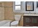 Bathroom featuring tile accents, vanity, and tiled shower at 1915 Peppertree Dr, Oldsmar, FL 34677