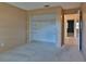 Bedroom featuring an open closet space and neutral carpeting at 1915 Peppertree Dr, Oldsmar, FL 34677