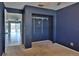 Bedroom showcasing a large closet space and neutral carpet flooring at 1915 Peppertree Dr, Oldsmar, FL 34677
