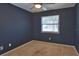 Cozy bedroom featuring carpet flooring and a window, providing natural light, creating a comfortable retreat at 1915 Peppertree Dr, Oldsmar, FL 34677