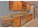 Spacious kitchen featuring granite countertops, stainless steel appliances, and plenty of cabinet space with a wine rack at 1915 Peppertree Dr, Oldsmar, FL 34677