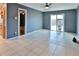Spacious living room with tile floors and sliding glass doors leading to the backyard, offering seamless indoor-outdoor living at 1915 Peppertree Dr, Oldsmar, FL 34677
