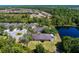 Beautiful aerial view showcasing the property with a screened lanai overlooking a pond at 19194 Lake Audubon Dr, Tampa, FL 33647