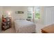 Bright bedroom with carpet, natural light, and a comfortable bed, creating a cozy retreat for rest and relaxation at 19194 Lake Audubon Dr, Tampa, FL 33647