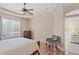 Comfortable bedroom with hardwood flooring, a chair, and a large window that brings in natural light at 19194 Lake Audubon Dr, Tampa, FL 33647