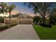 Charming home with a well-maintained lawn, mature landscaping, and a spacious driveway leading to a two-car garage at 19194 Lake Audubon Dr, Tampa, FL 33647