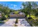 Charming townhome with a two-car garage, mature trees, and beautiful landscaping at 19194 Lake Audubon Dr, Tampa, FL 33647