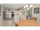 Open kitchen with white cabinetry, stainless steel appliances, and ample counter space at 19194 Lake Audubon Dr, Tampa, FL 33647