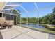 Enjoy outdoor living on this lanai overlooking a peaceful pond and lush landscape at 19194 Lake Audubon Dr, Tampa, FL 33647