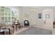 Inviting living room with a large window, neutral paint, and tile flooring for a bright and airy feel at 19194 Lake Audubon Dr, Tampa, FL 33647