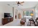 Bright living room with a sliding glass door to the patio and an open layout at 19194 Lake Audubon Dr, Tampa, FL 33647