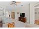 Spacious living room with neutral tile flooring, high ceilings, and ample space for entertaining at 19194 Lake Audubon Dr, Tampa, FL 33647