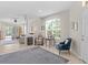 Bright and airy living room features neutral decor, tile flooring, and plenty of natural light at 19194 Lake Audubon Dr, Tampa, FL 33647