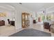 Open-concept living space with tile floors, recessed lighting, and seamless access to an adjacent office at 19194 Lake Audubon Dr, Tampa, FL 33647