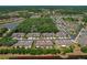 Aerial view showcases the property's location in a residential community near a scenic pond at 20117 Indian Rosewood Dr, Tampa, FL 33647