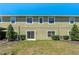 Exterior view of the property's backyard with a green lawn at 20117 Indian Rosewood Dr, Tampa, FL 33647