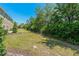Backyard featuring a lush lawn and a sturdy, secure fence at 20117 Indian Rosewood Dr, Tampa, FL 33647