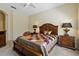 Nicely decorated bedroom with queen-size bed, side tables, and lamps at 20117 Indian Rosewood Dr, Tampa, FL 33647