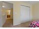 Bedroom showcasing closet, neutral walls and door leading to additional rooms and ensuite bathroom at 20117 Indian Rosewood Dr, Tampa, FL 33647