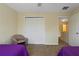 Bright bedroom featuring a double closet and neutral carpeting at 20117 Indian Rosewood Dr, Tampa, FL 33647
