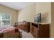 Bedroom featuring queen-sized bed, side tables, and a dresser, providing comfort and functionality at 20117 Indian Rosewood Dr, Tampa, FL 33647