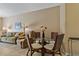 Dining area featuring table, chairs, and lighting fixture, adjacent to the living room for easy access and entertaining at 20117 Indian Rosewood Dr, Tampa, FL 33647