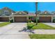 Charming townhome featuring a well-manicured lawn and two-car garage at 20117 Indian Rosewood Dr, Tampa, FL 33647