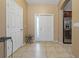 Spacious tiled foyer with natural light and access to the kitchen at 20117 Indian Rosewood Dr, Tampa, FL 33647