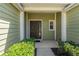 Welcoming front entrance with a covered porch and tidy landscaping at 20117 Indian Rosewood Dr, Tampa, FL 33647