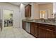 Kitchen featuring stainless steel dishwasher, granite countertops, and a view of the laundry area at 20117 Indian Rosewood Dr, Tampa, FL 33647