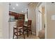 Kitchen bar area with seating and view to the kitchen and nearby hallway at 20117 Indian Rosewood Dr, Tampa, FL 33647