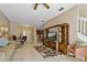 Inviting living room featuring a comfortable sofa, dining area, and entertainment center at 20117 Indian Rosewood Dr, Tampa, FL 33647