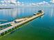 A stunning aerial view of a waterfront pier featuring modern architecture, palm trees, and beautiful Gulf of Mexico views at 2050 28Th N Ave, St Petersburg, FL 33713